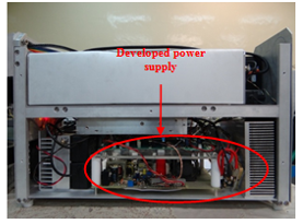 Photograph showing (a) the laser diode power converter board, and (b) its integration in the laser marker system.