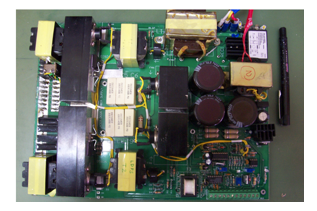 Photograph showing (a) 80A/6V laser diode power converter board, and (b) its integration in the laser marker system.