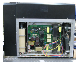 Photograph showing (a) 80A/6V laser diode power converter board, and (b) its integration in the laser marker system.