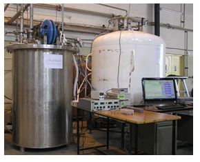 Photograph showing indigenous helium liquefier liquefying helium in a 1,000 liter Dewar at a liquefaction rate of 35 lit/hr