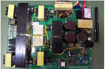 Photograph showing (a) 80A/6V laser diode power converter board, and (b) its integration in the laser marker system